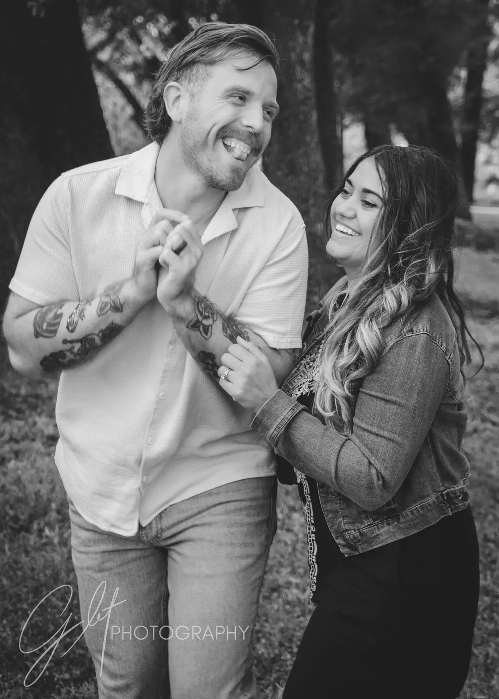 A couple mid-laugh in black and white — a prompted moment that turned genuinely real