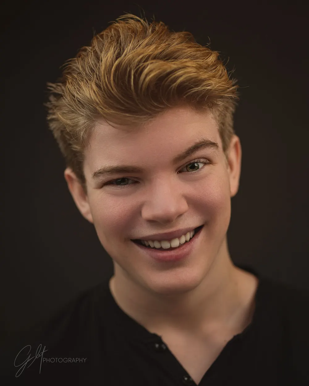 A wide, genuine laugh that reaches the eyes
